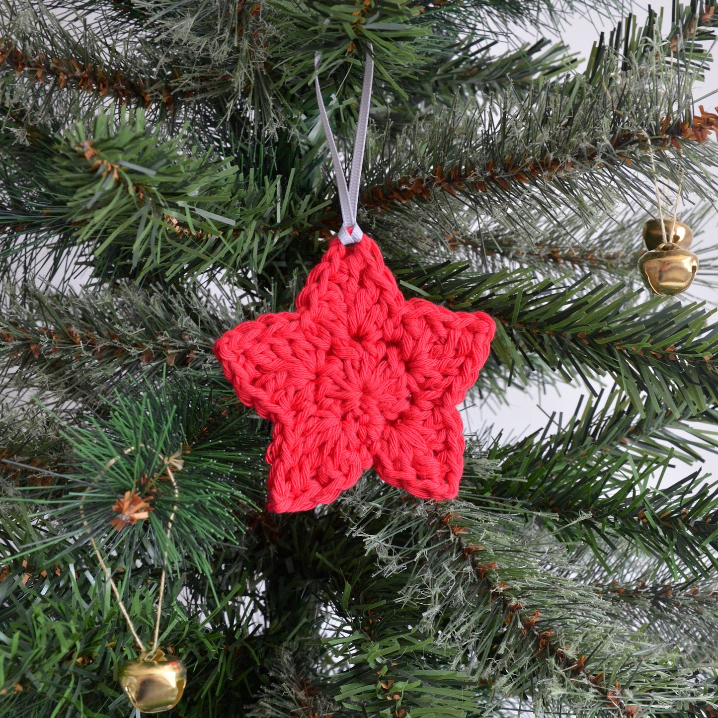 Red star decoration on Christmas tree
