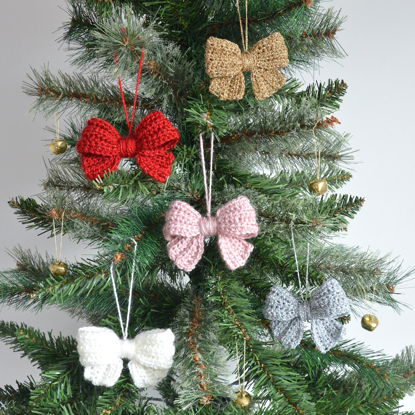 Christmas tree decorated in sparkly crochet bow decorations
