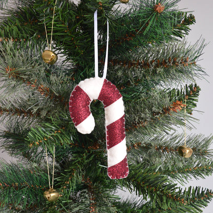 Red candy cane decoration hanging on a Christmas tree