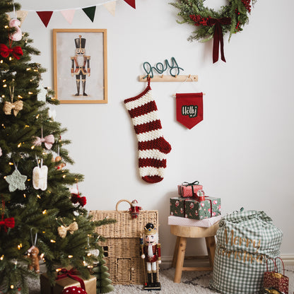 decorated Christmas tree with presents and a hanging stocking