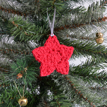 Red star decoration on Christmas tree