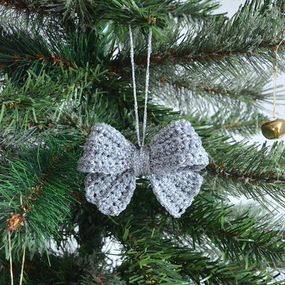 Silver crocheted bow decoration on a Christmas tree